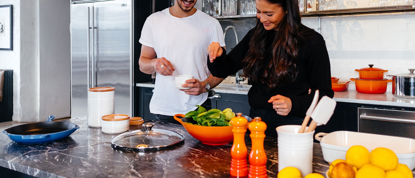 Two people cooking