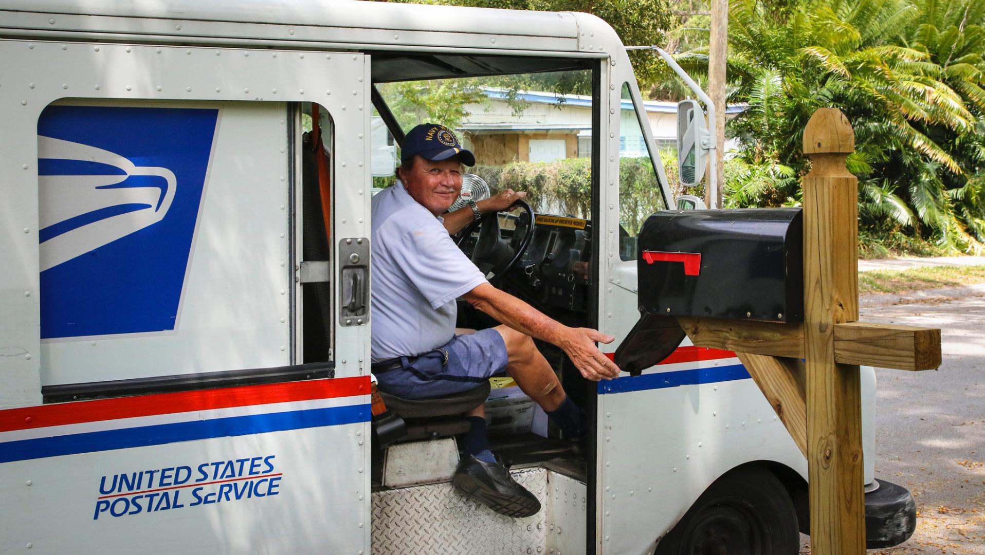 USPS mail truck and driver