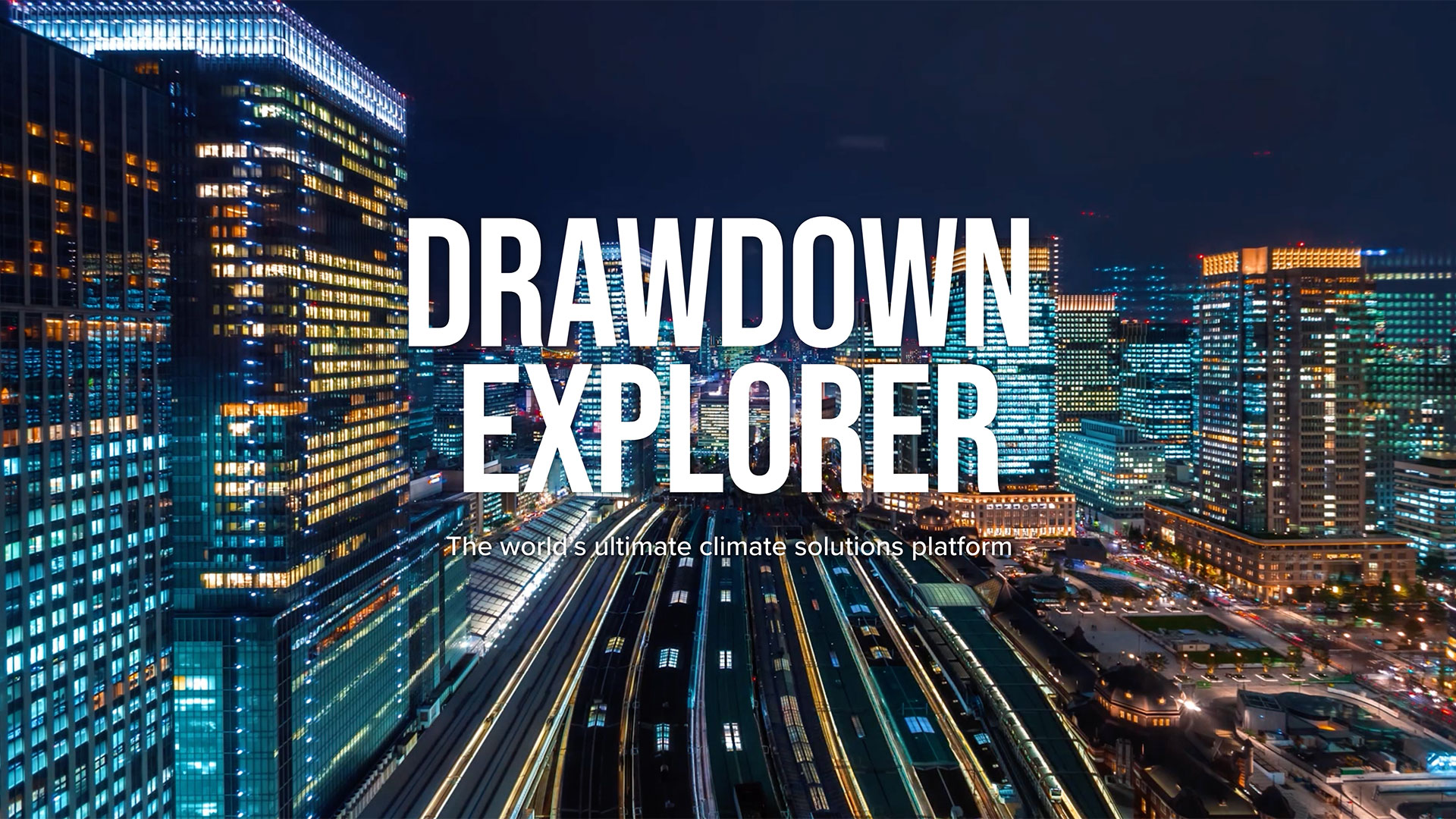 Drawdown Explorer title over still image of Tokyo station at night.